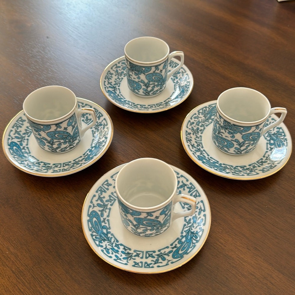 Espresso cups and matching saucers.